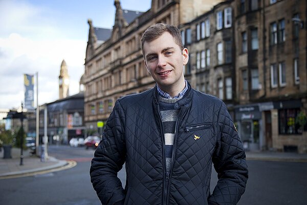 Jack Clark in front of road in centre of Paisley
