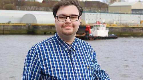 Ross Stalker in front of the River Clyde