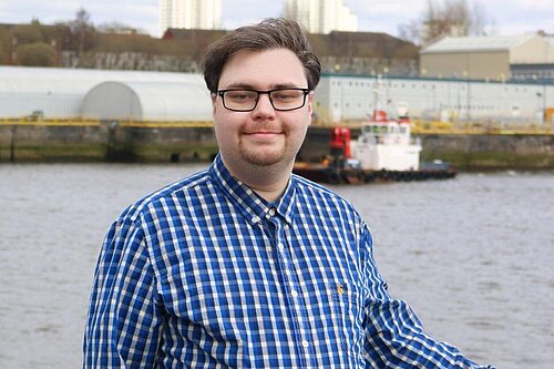 Ross Stalker in front of the River Clyde