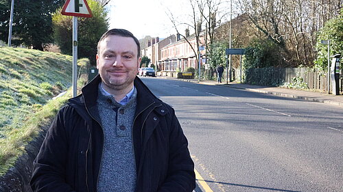James Kenyon standing next to a street.