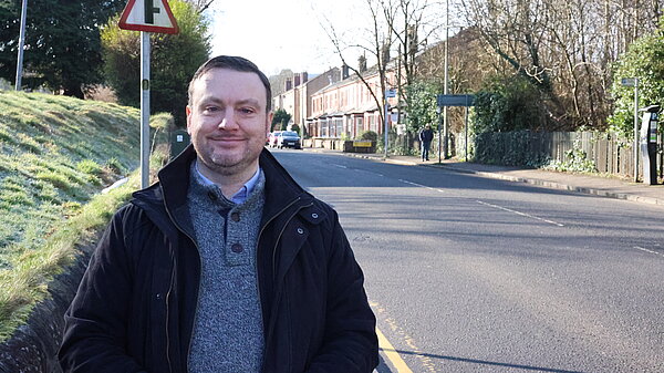 James Kenyon standing next to a street.
