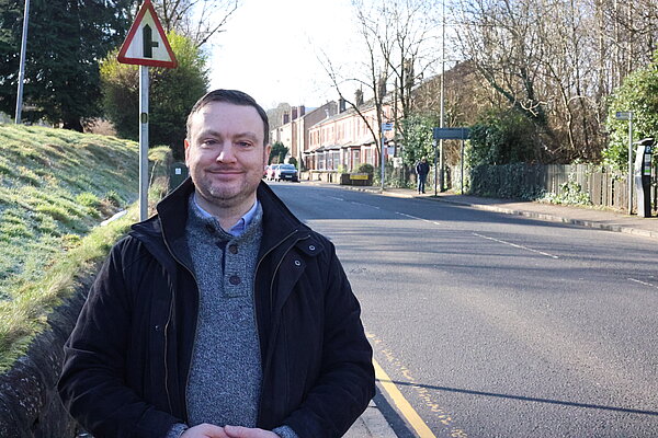 James Kenyon standing next to a street.